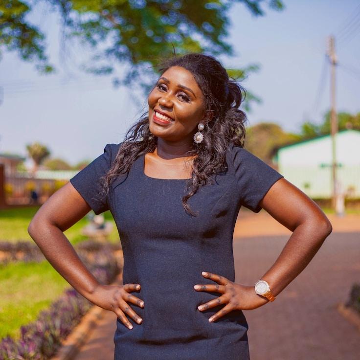 Alex Rivera, Lead Design Curator at RidgeQuietMead, reviewing corporate floral arrangements